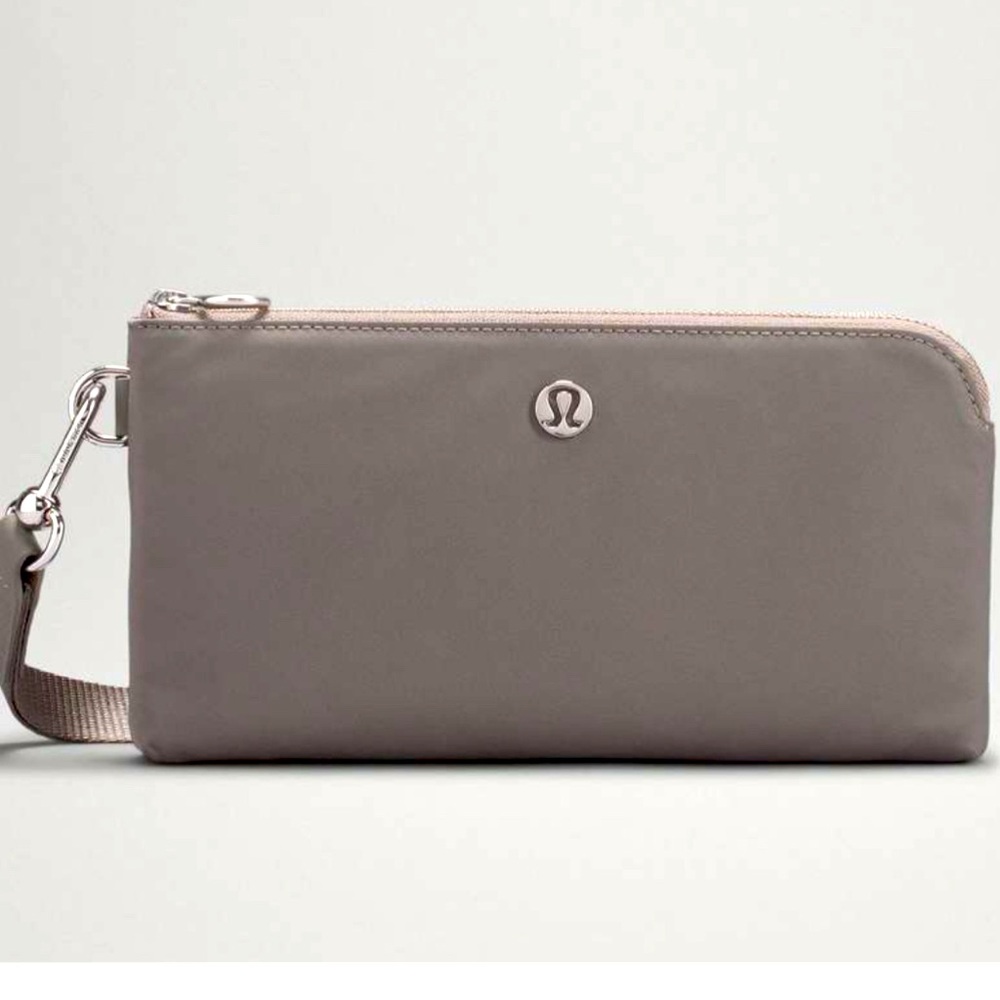 Lululemon “Now and Always” Pouch. 2 zipper & 1 hidden pockets. Water Repellent.